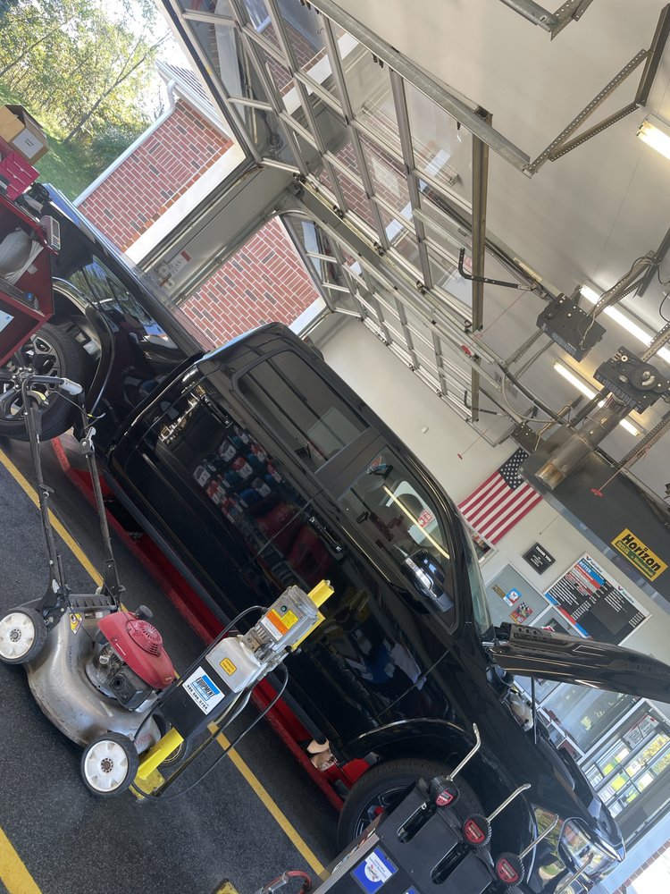 Vehicle being serviced inside Ortonville Quick Lube